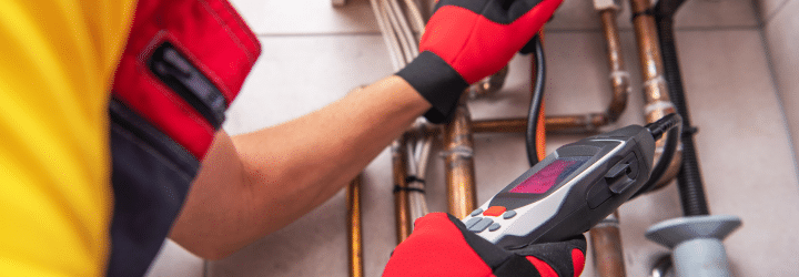 Technician inspecting a sewer line with a camera system