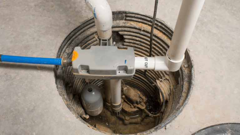 A sump pump installed in a basement of a home with a water powered backup system.